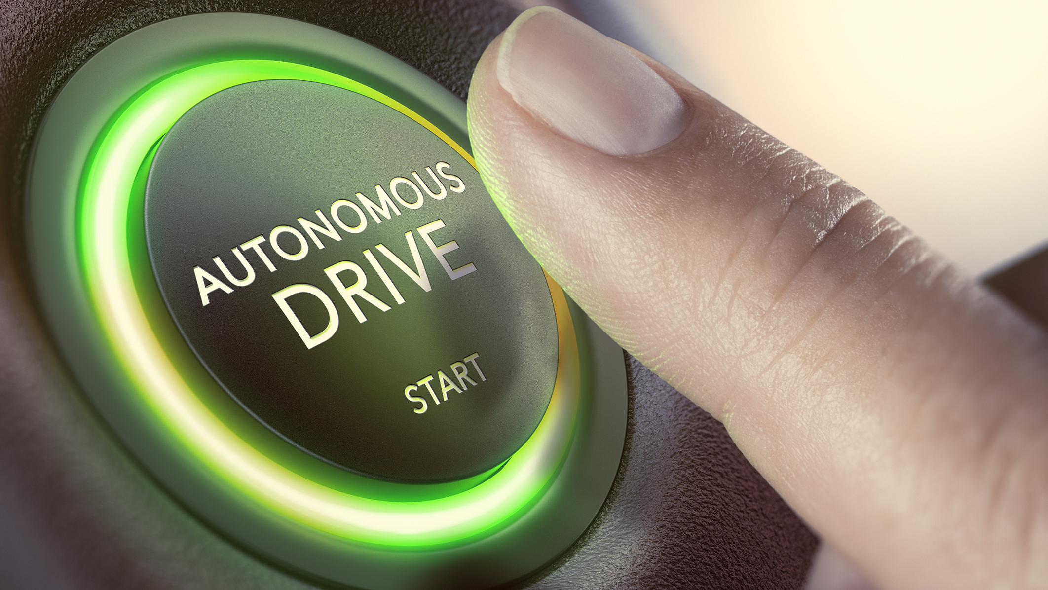Finger der auf beleuchteten Startknopf eines selbstfahrenden Fahrzeugs zeigt.