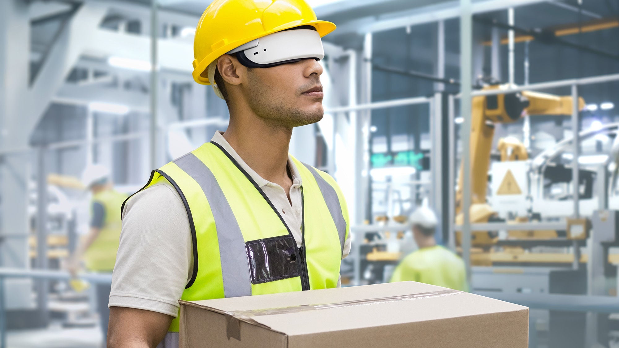 Worker carrying box in warehouse